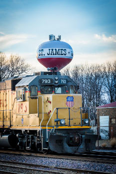 St. James water tower with train in front