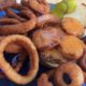 picture of a burger and onion rings